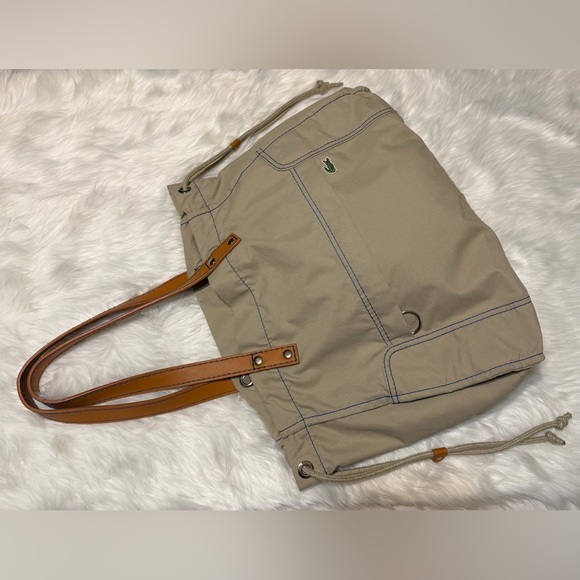 Lacoste Handbags - Lacoste Beige Canvas Sportsman Drawstring Tote with Tan Leather Handles